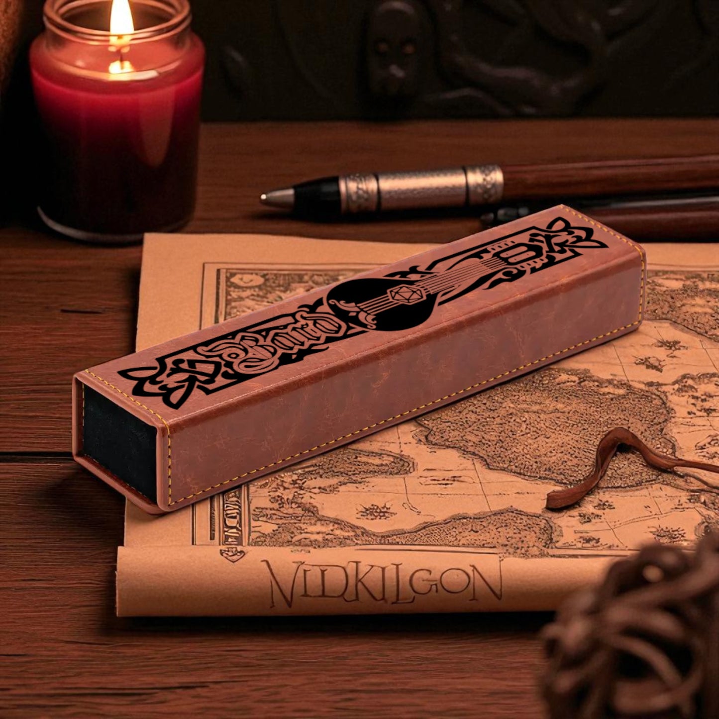 a wooden desk with a map, a candle, a pen, and a box with a guitar design.