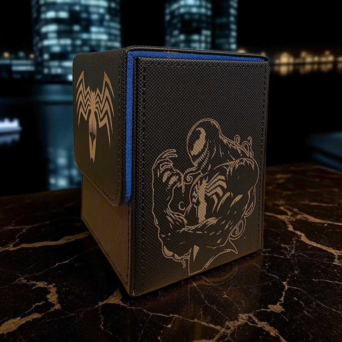 A black and blue storage box with a design featuring a spider-like creature, likely inspired by the Marvel superhero Spider-Man.
