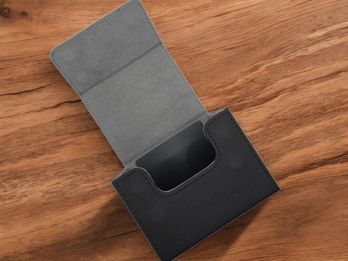 a cell phone case sitting on top of a wooden table