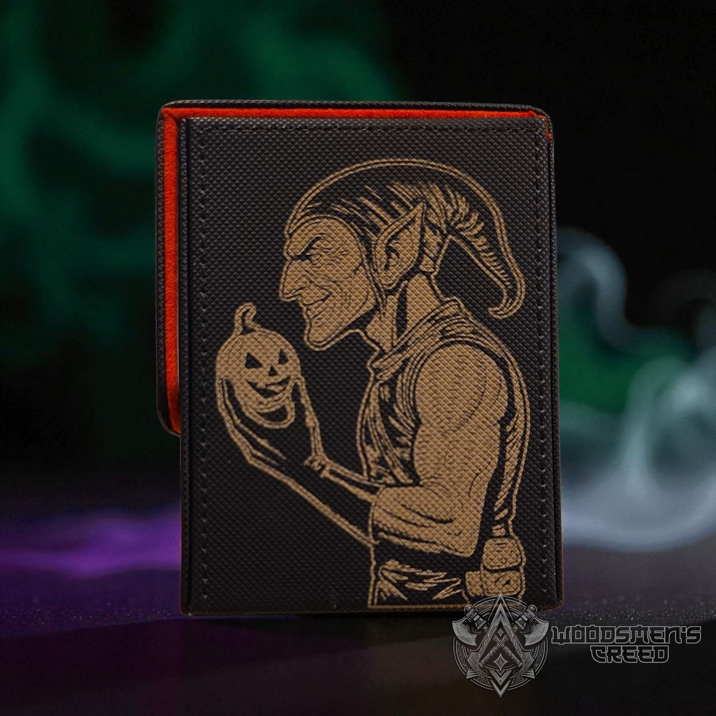 A wallet with a printed design of a jester or clown holding a pumpkin.