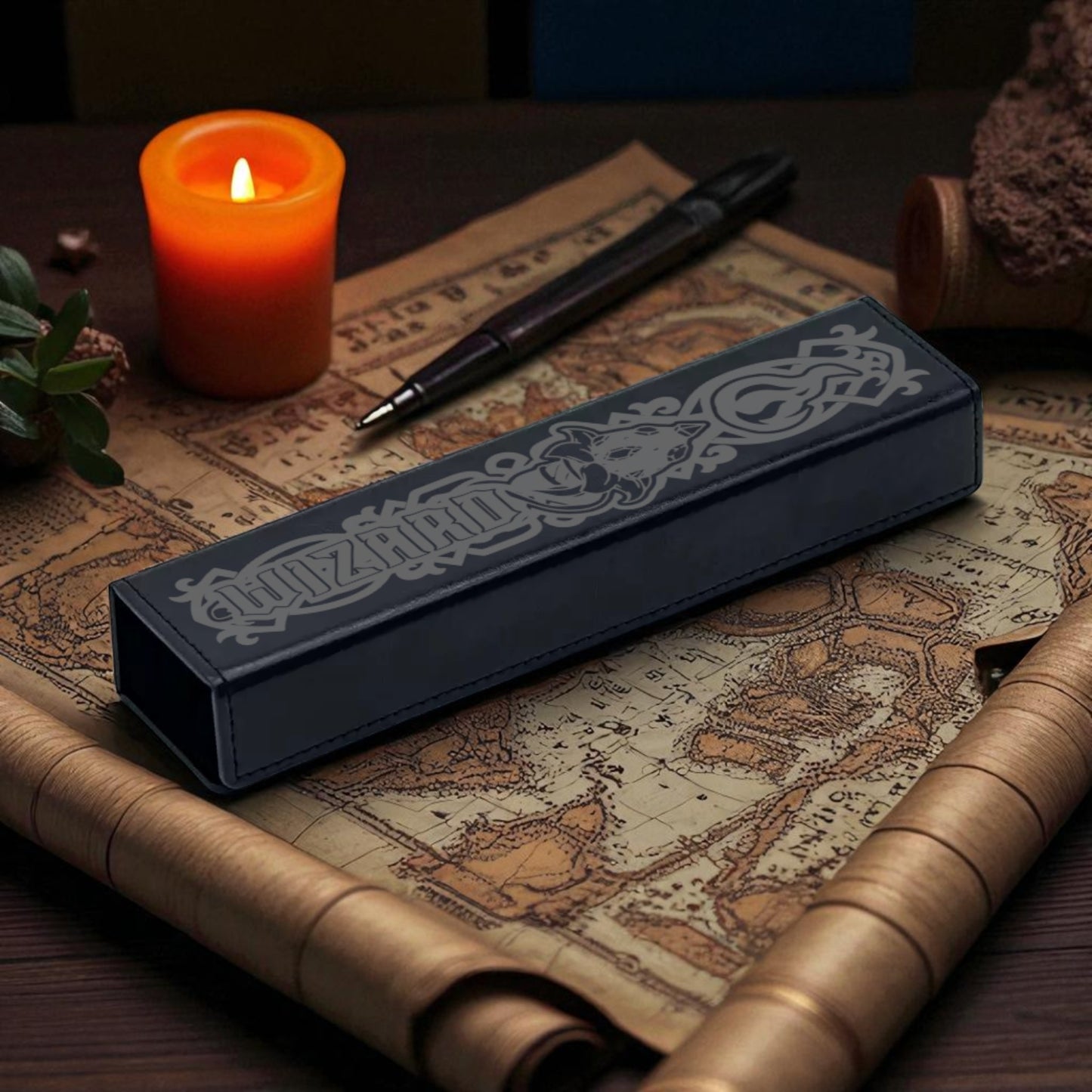 a candle, a pen, and a map, all arranged on a wooden surface.