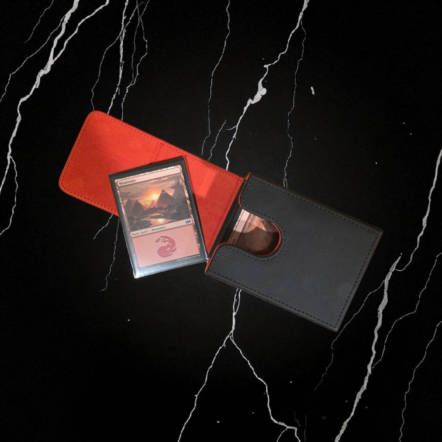A red and black wallet is open, revealing a card inside, which appears to be a Magic: the Gathering card.