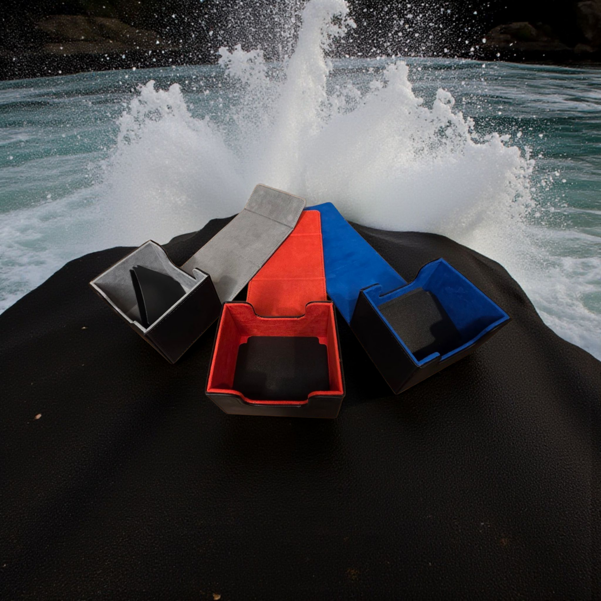 a collection of colorful boxes or containers placed on a black surface, with water splashing around them, creating a dynamic and visually interesting scene.