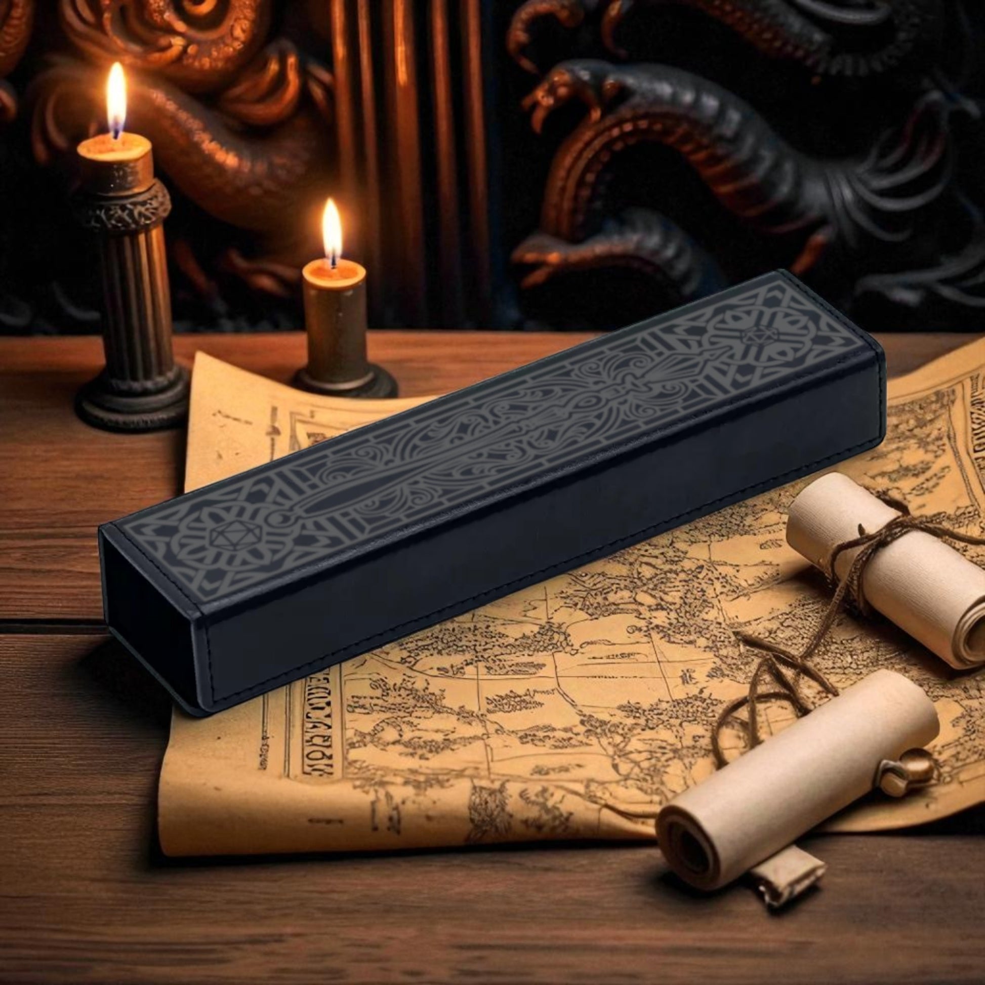 a dark blue rectangular object with an intricate design, placed on top of a map and a scroll, with two lit candles in the background.