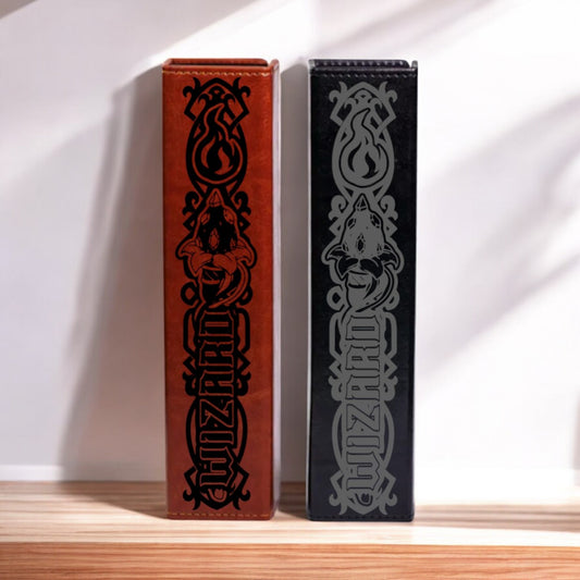 Two leather-bound books with the title "WIZZARD" printed on them, one in red and one in black.