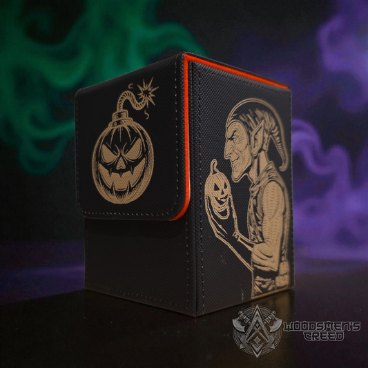 A black and orange magic box with a Halloween-themed design, including a jack-o-lantern and a gnome-like character.