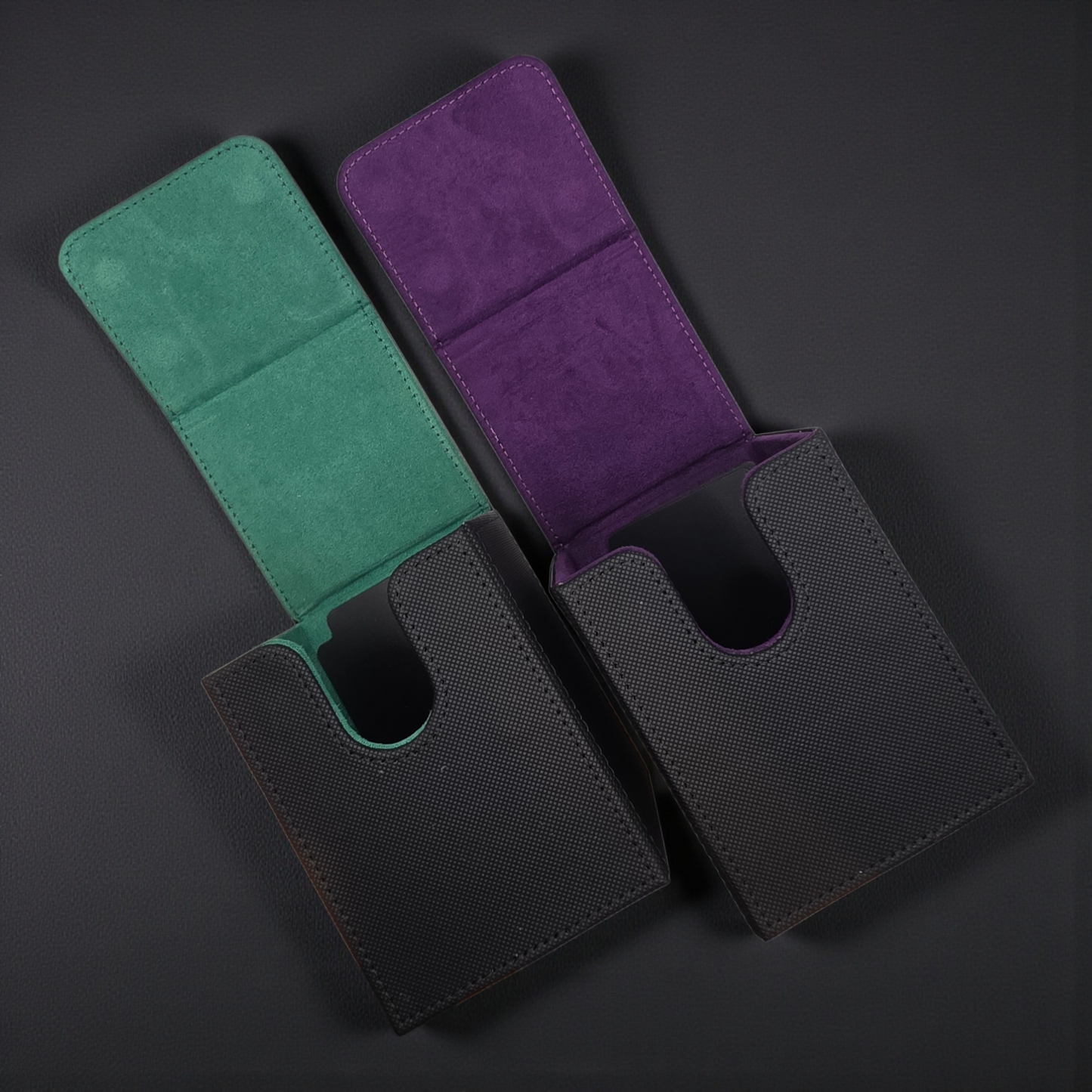 two open wallets, one green and one purple, placed on a dark surface.