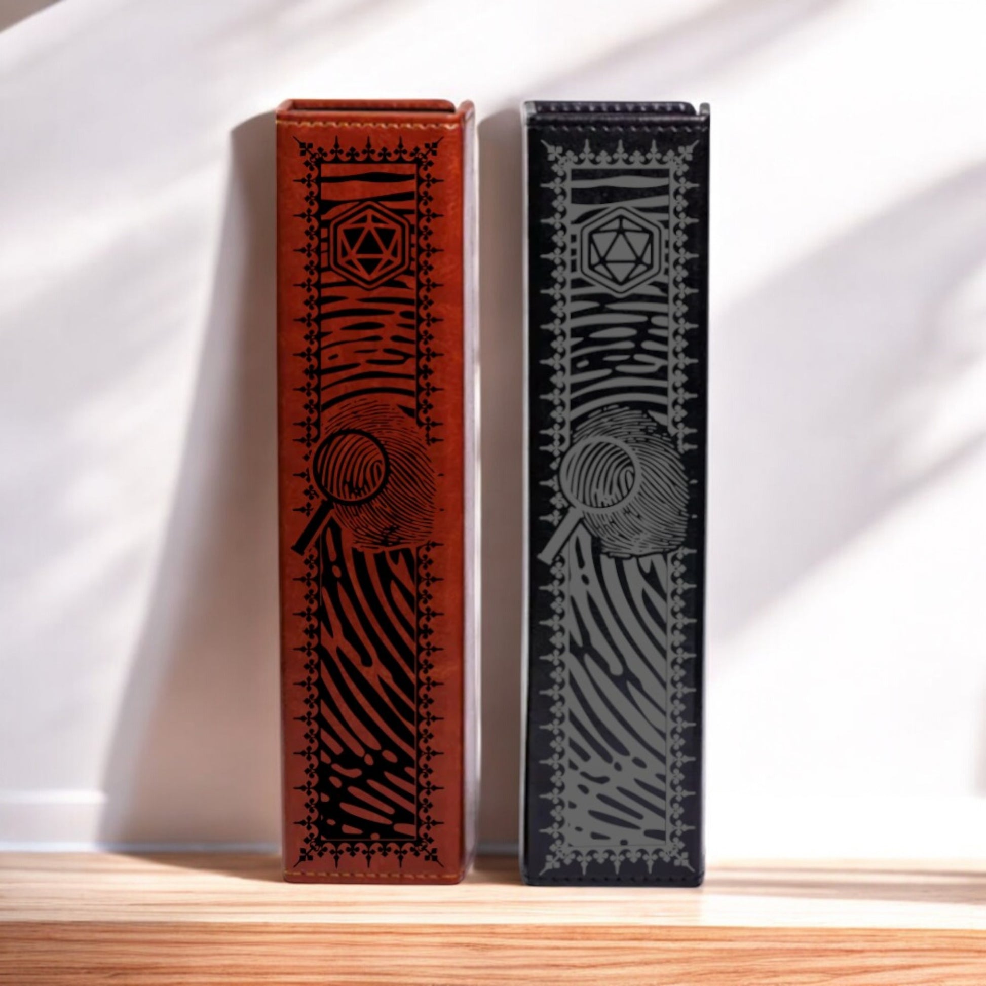 Two leather-bound books with decorative patterns stand upright against a white wall.