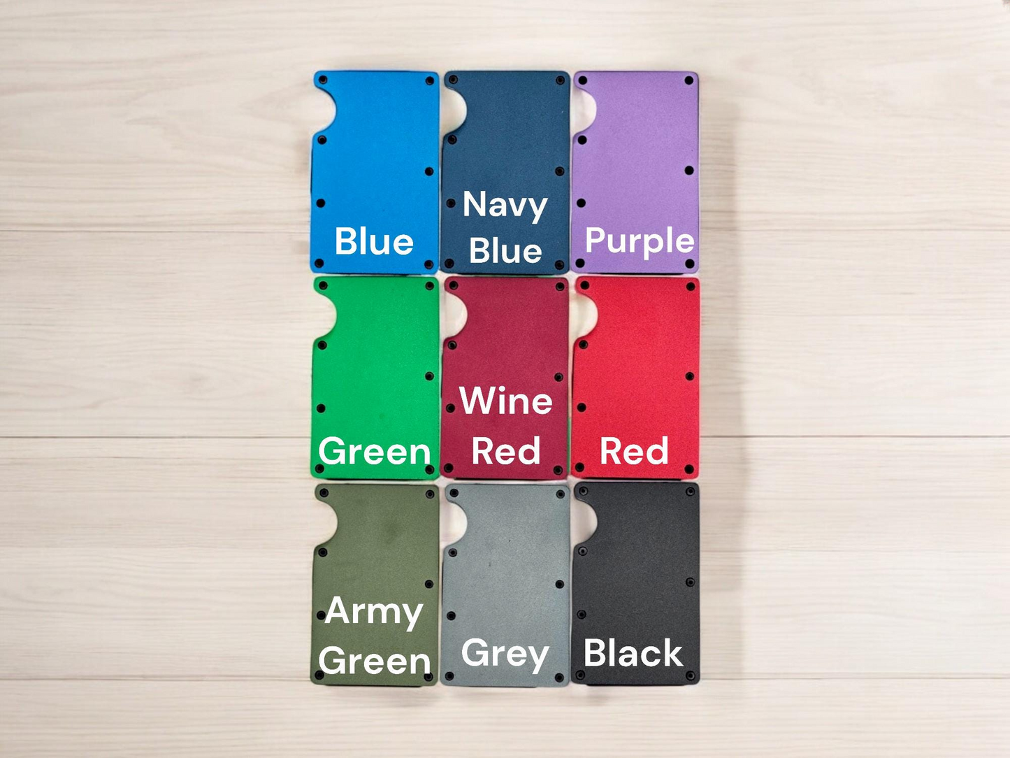 A collection of nine wallet cards in various colors, including blue, navy blue, purple, green, wine red, red, black, and army green.